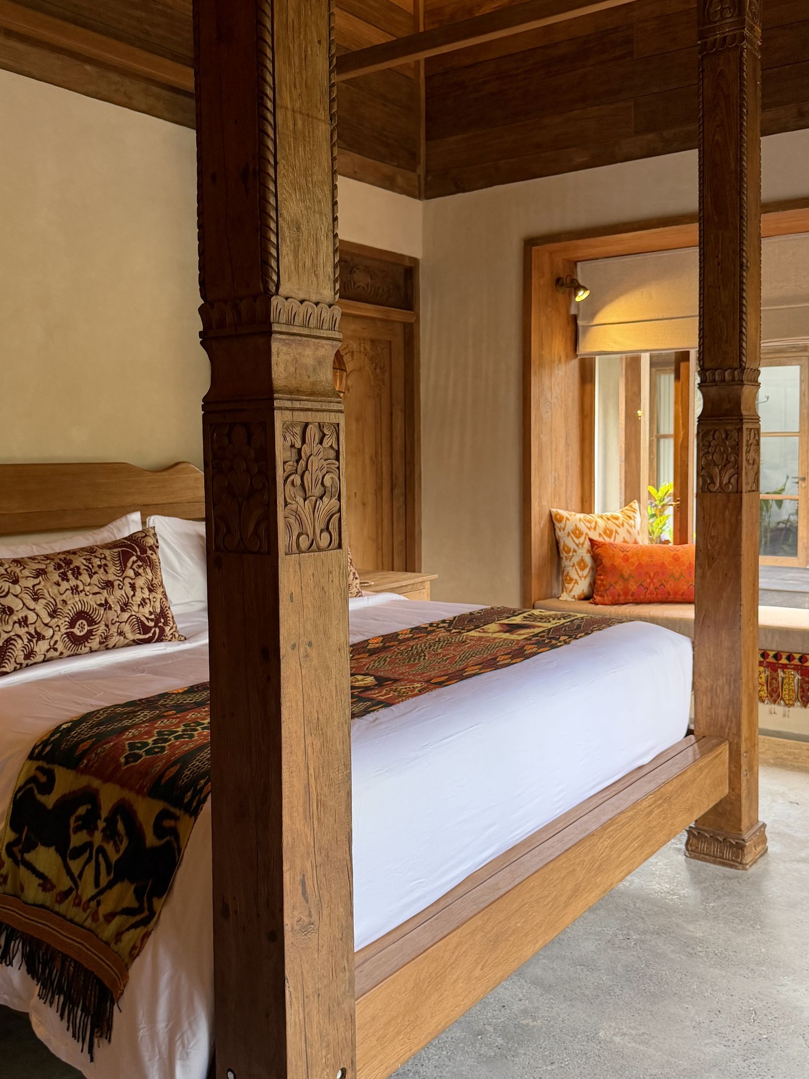 Carved four-poster canopy bed